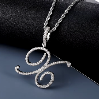 Silver necklace with a decorative pendant on a dark background