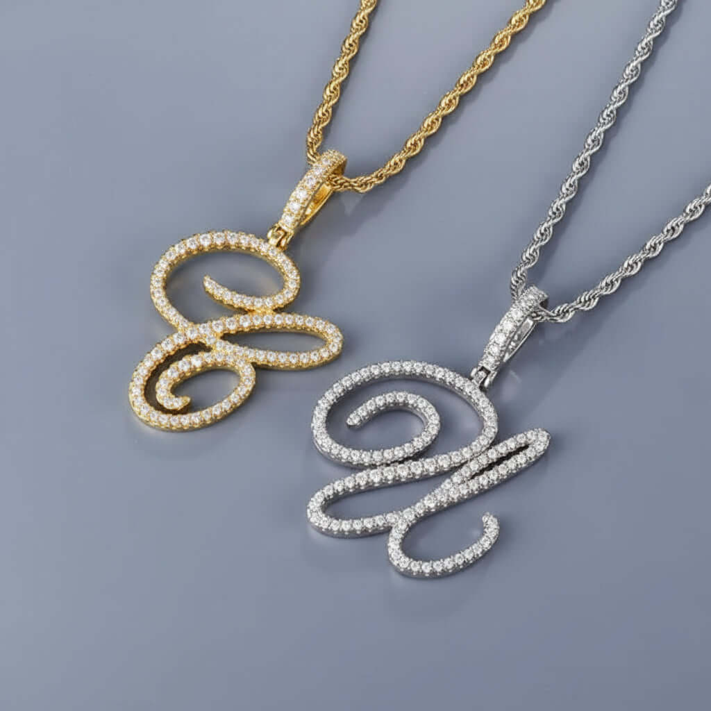 Gold and silver necklaces with intricate pendants on a dark surface